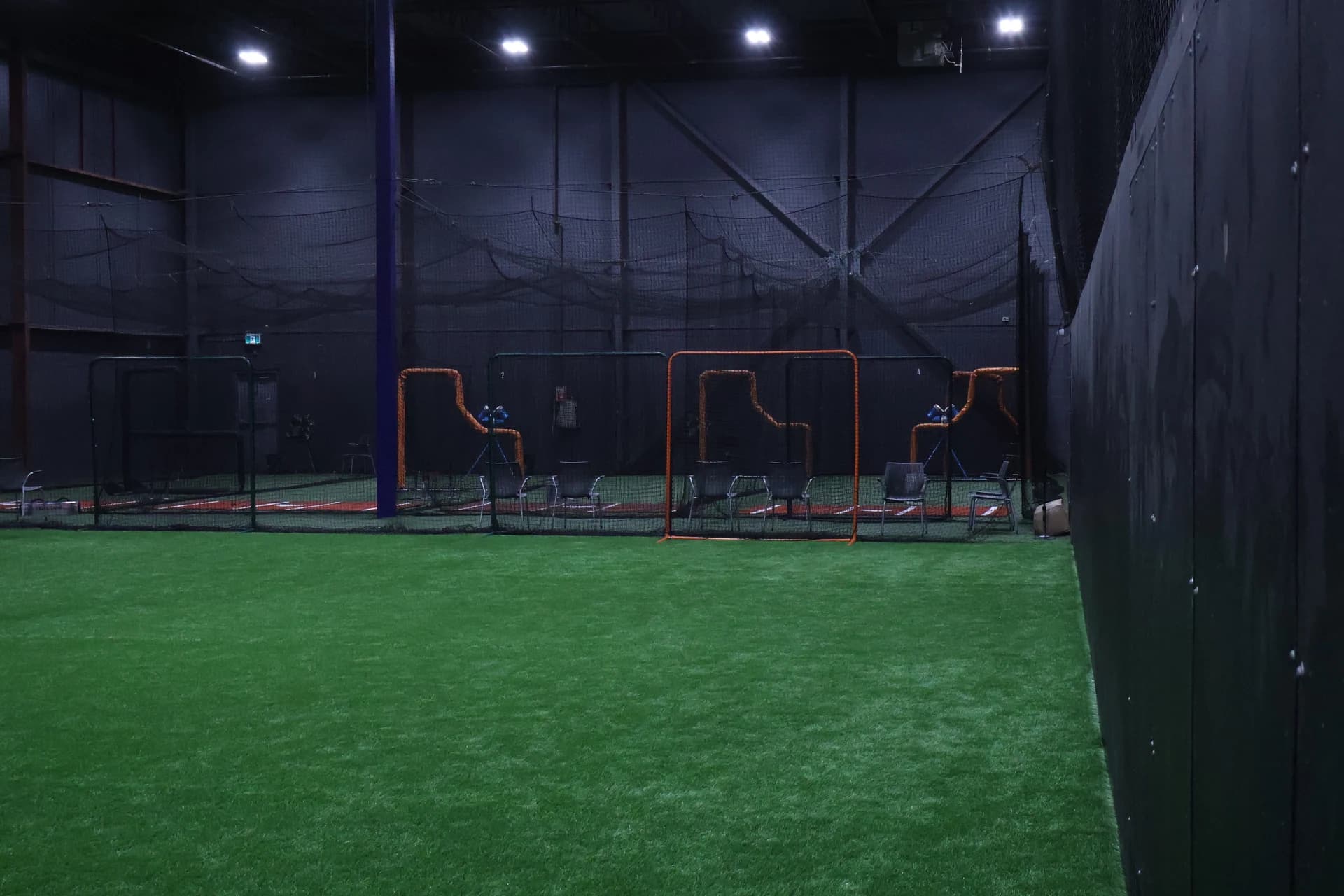 Indoor turf leading toward the batting cages
